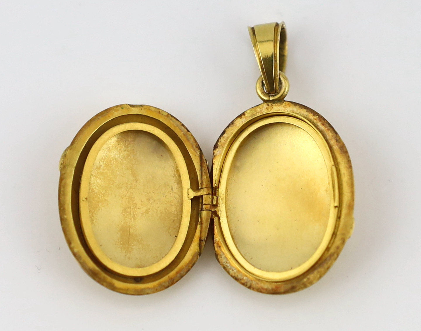 A Victorian gold, enamel and rose cut diamond set oval locket